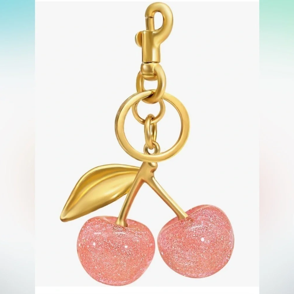 Cherry Pink sparkles with gold leaf clips onto your coach purse